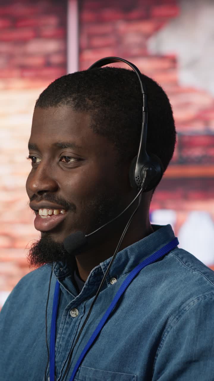Vertical video Portrait of smiling technical support specialist in call center office