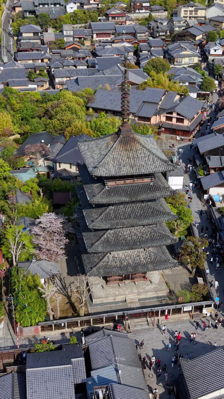 Aerial drone view of the Yasaka Pagoda temple in daylight in Kyoto, Japan