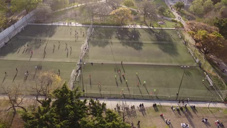 female football players training on soccer field in argentina park