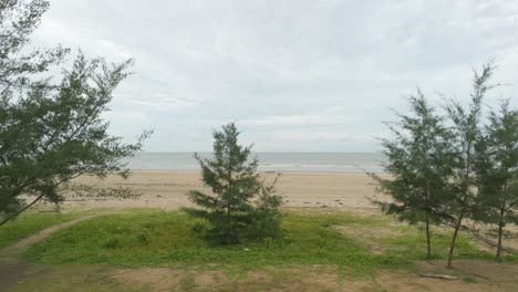 beautiful aerial drone view summer at tanjung kembang water park beach kabong , white sandy beaches, coconut,and palm oil plantation,longe house,homestay,seratok,sarawak,borneo.
