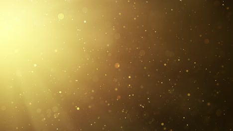 abstract background with golden glittering dust: slow motion animation of sunbeams and stardust floating