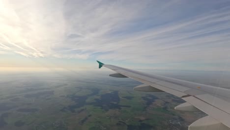airplane on flight from riga airport going to munich international airport in germany. pov shot