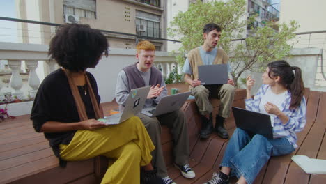 gen z team discussing business ideas at outdoor coworking space