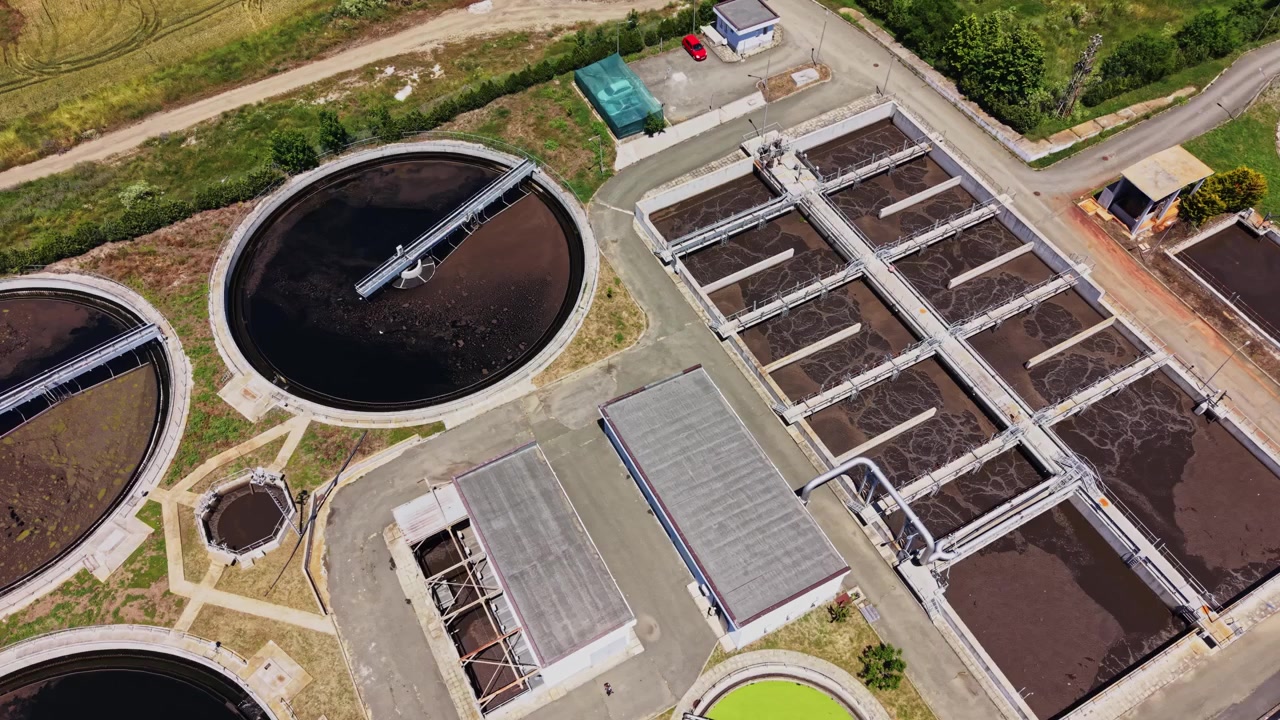 Water treatment facility shows tanks and equipment for processing water
