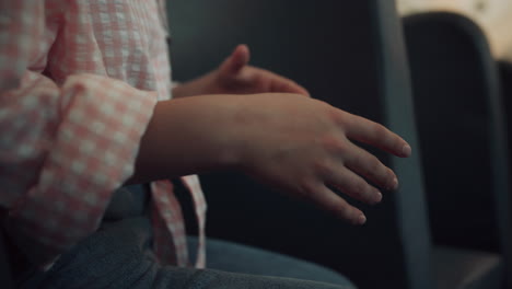 Unrecognized-teenager-gesturing-hands-talking-with-friends.-Close-up-girl-palms.