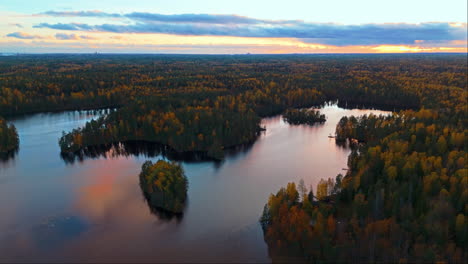 a lake in the middle of an endless wilderness forest in southern finland