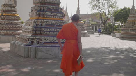 monk walking through buddhist temple