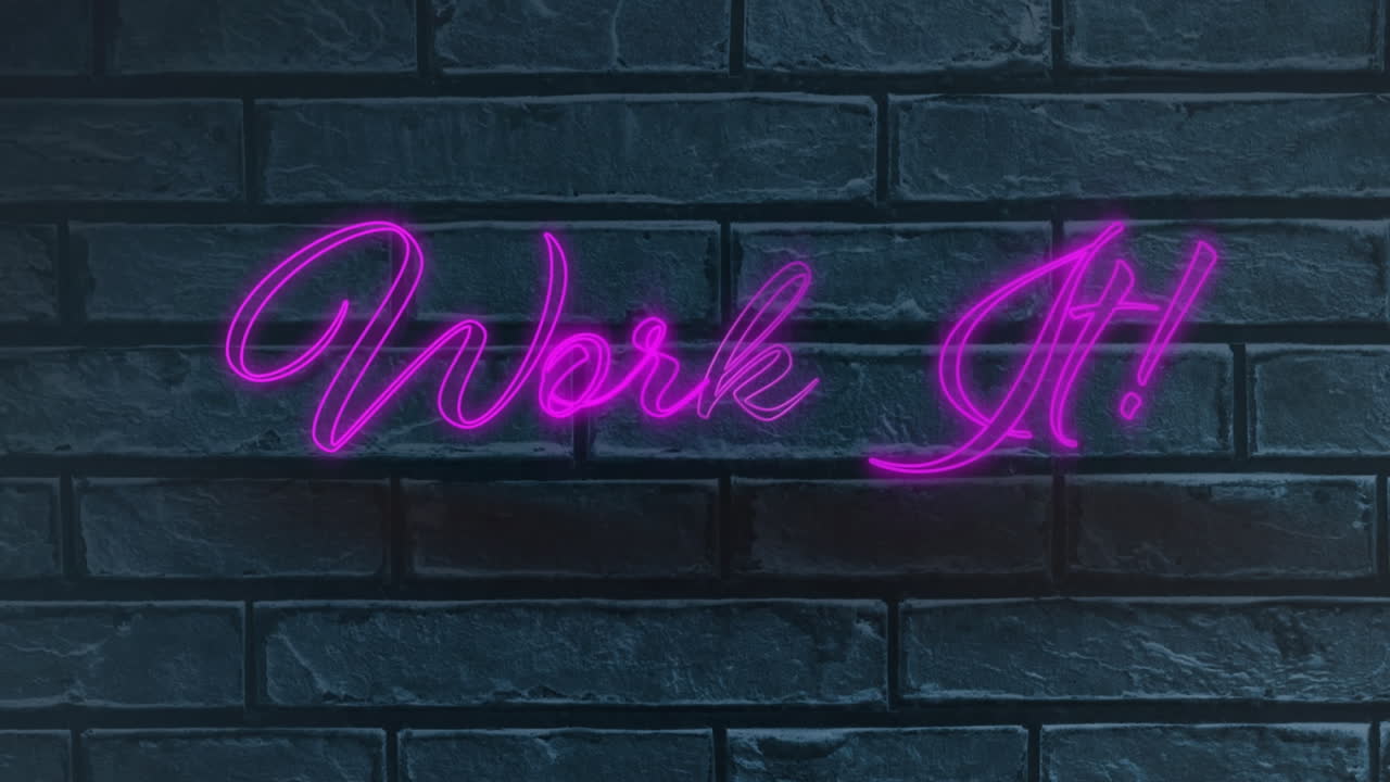 Neon purple work it text against grey brick wall in background