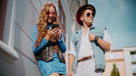 trendy couple posing outdoors