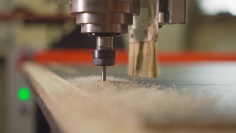 Lathe machine head with drill goes down and carves plywood