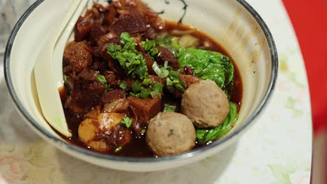 a bowl of chinese street food in hong kong