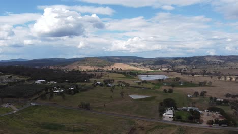 flying over a typical australian countryside with farms and dams