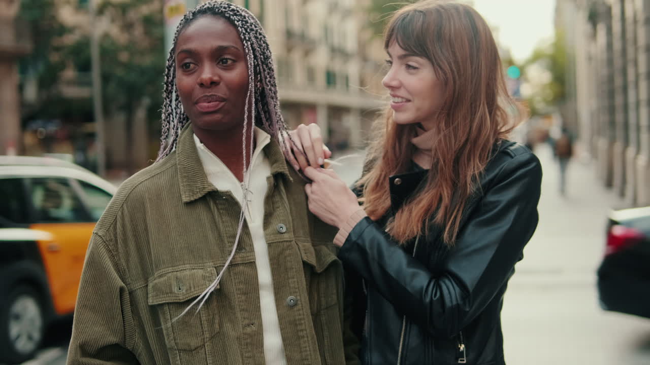 Two women talking on the street