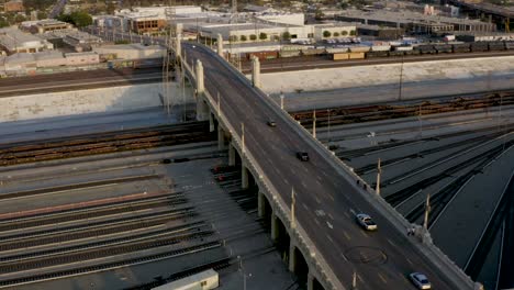 4th-Street-Bridge-Crossing-into-Suburbs-in-Los-Angeles,-California---Aerial-Drone-Establishing-View