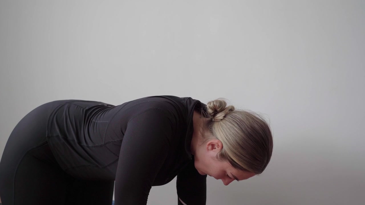 Side close-up of a person on hands and knees performing controlled quadruped scapular push-ups to build shoulder stability and upper back control.