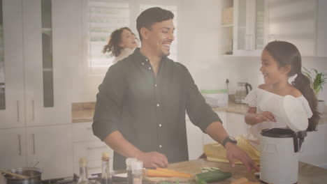 animación de luces sobre feliz padre y hija hispanos aplaudiendo en la cocina