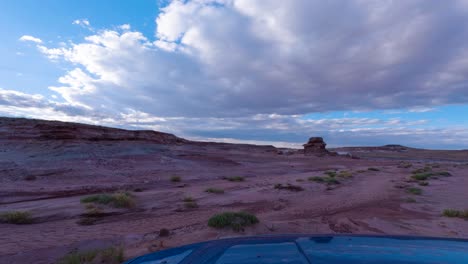 driving off-road through the caineville desert by buttes and hoodoos