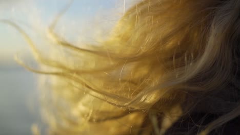 Wind-blows-girls-blonde-hair-in-slow-motion