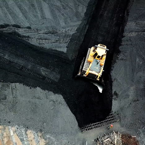 bulldozer sorts coal. extractive industry, anthracite. coal industry. aerial view.