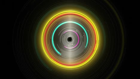 Animation-of-glowing-blue,-yellow-and-pink-spinning-circles