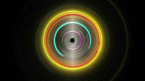 animation of glowing blue, yellow and pink spinning circles