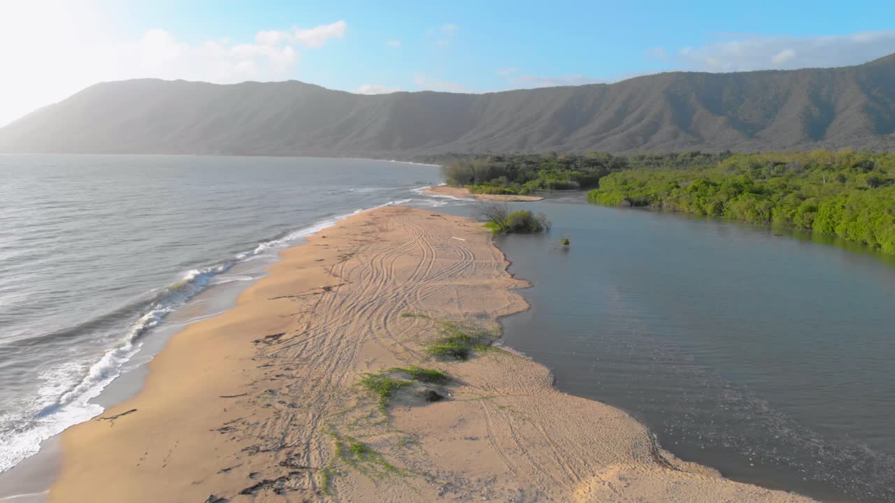 Aerial drone shot of a beach in Far North Queensland. Forward moving along the beach.