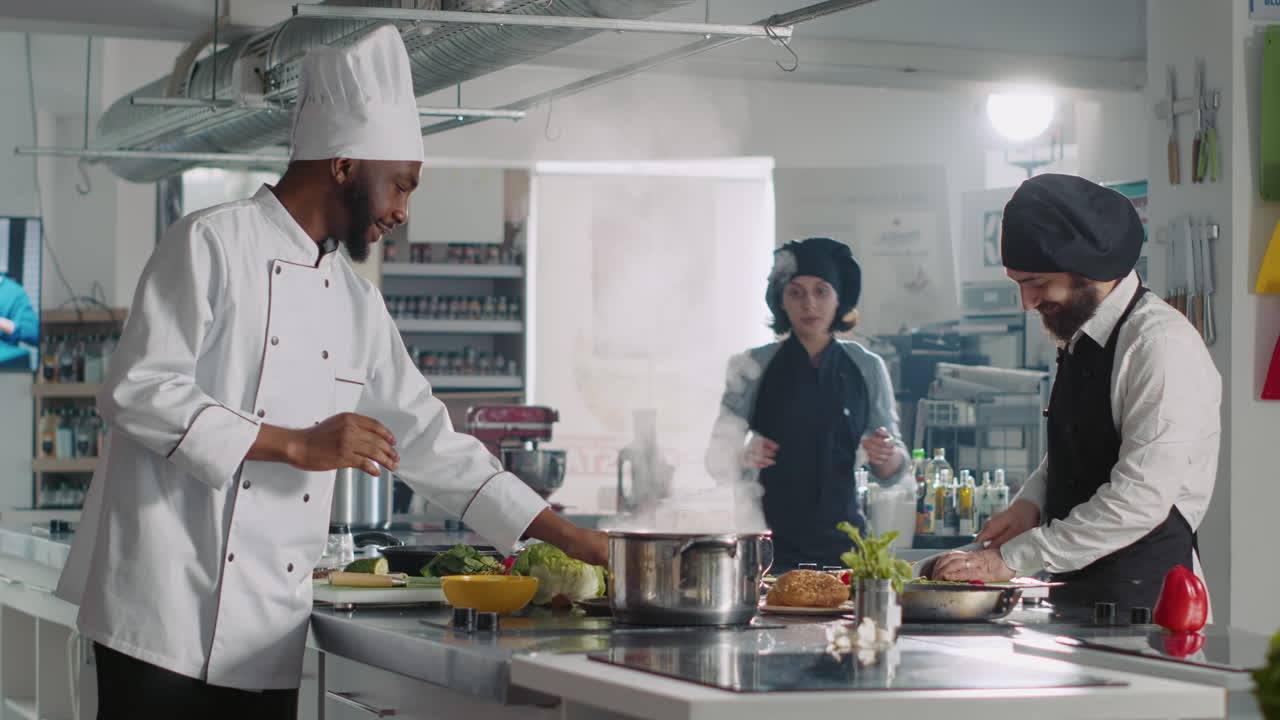 POV of professional chefs hosting cooking show on TV program