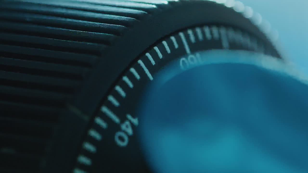 Macro Shot of Turning Adjustment Knob on Laboratory Microscope