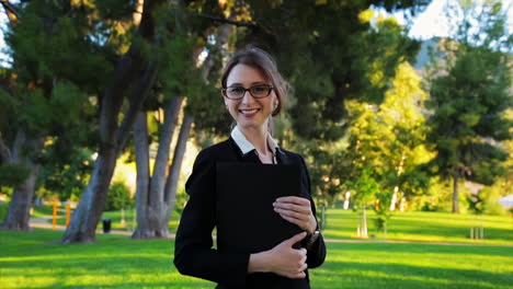 attractive caucasian business woman looks at the camera with a huge smile