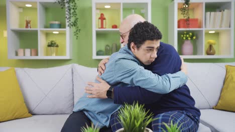 Emotional-grandfather-and-grandson-hug-each-other-and-try-to-comfort-each-other.