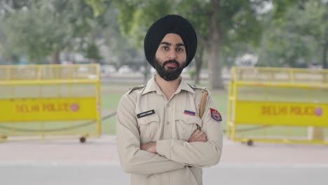 confident sikh indian police man standing
