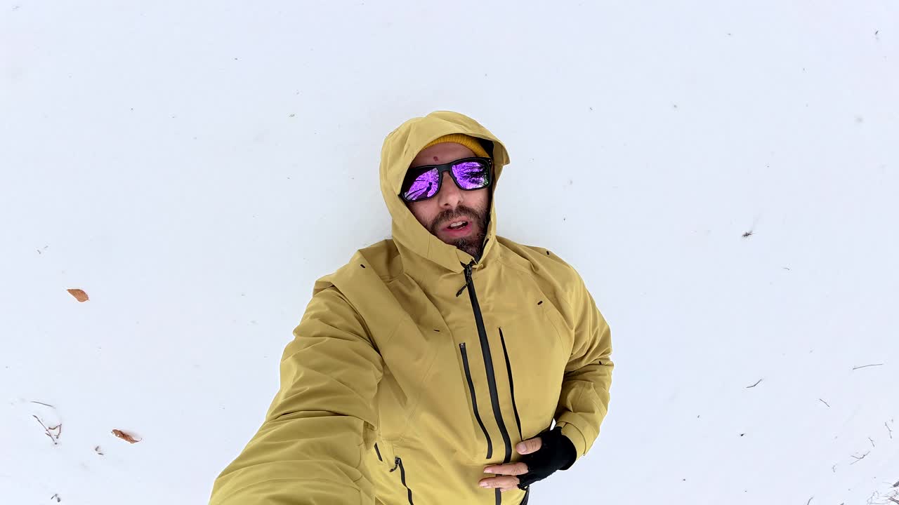 Man in snow with sunglasses