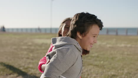 portrait of little boy smiling friend surprise playing cheerful enjoying games at sunny seaside park