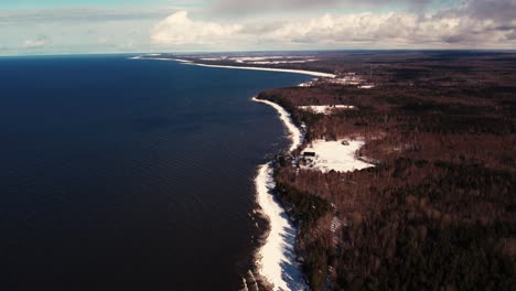 Drone-flight-over-the-sea-in-winter-Frozen-rocks-on-the-coast