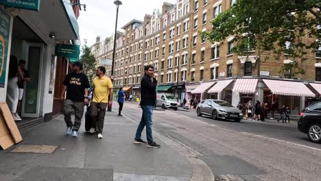 pedestrians and vehicles on a bustling city street