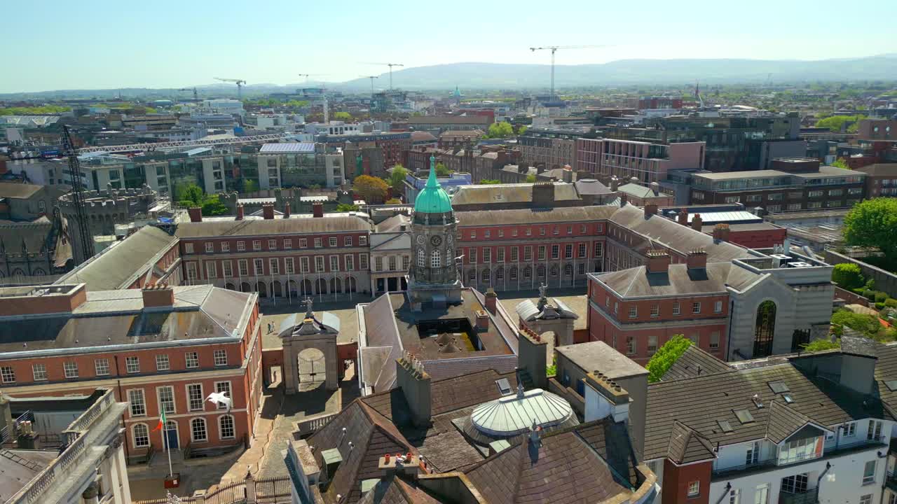 Wide, descending aerial video of Dublin City Hall in the Temple Bar area of Dublin, Leinster, in Ireland on a bright and sunny day. Filmed in 4K, 60FPS and with Rec709 color.