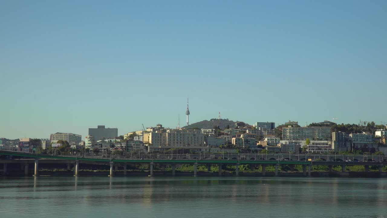 Scenic view of the Seoul city skyline, Hangang River and the Yongsan Tower on with a clear blue sky