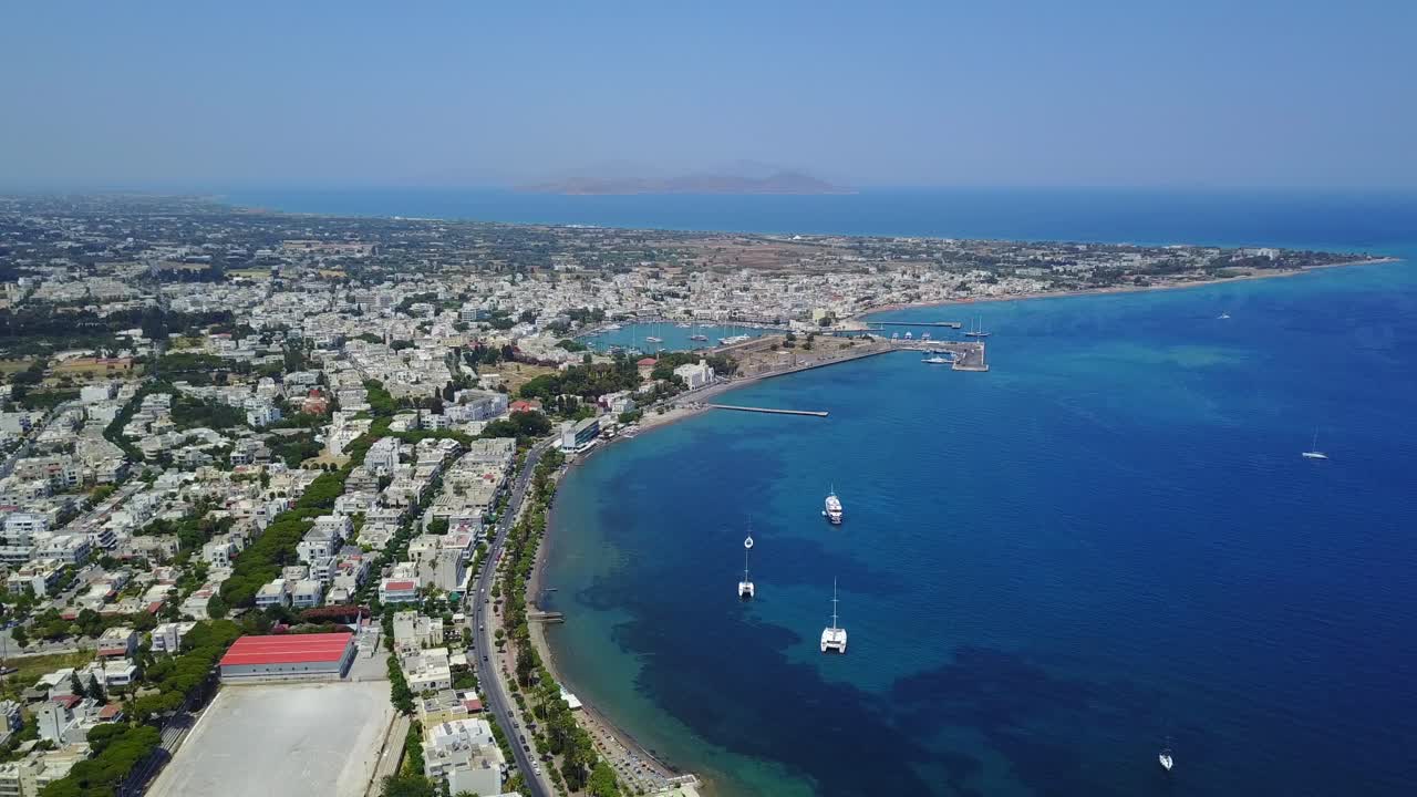 Drone panorama shot of the Rhodes island with a view of city, old harbour and coastline.