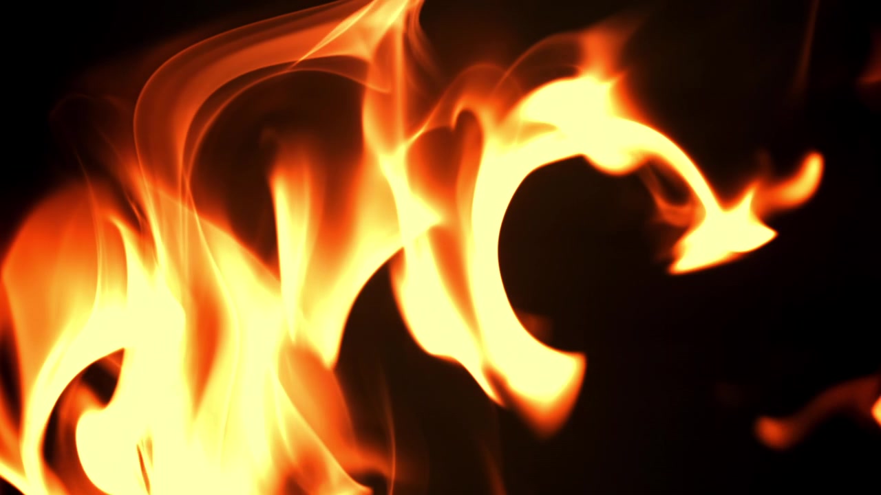 Dynamiske abstrakte flammer bevæger sig på sort baggrund.