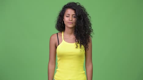 young beautiful hispanic woman clapping hands