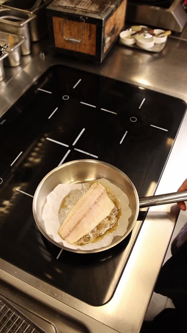 Fish being cooked in a pan