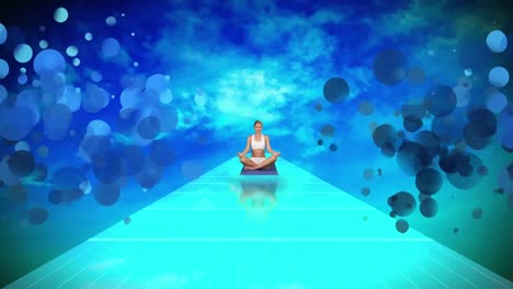 young woman doing yoga siting on blue floor against blue sky