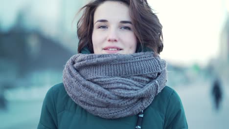 woman wearing a scarf in the city