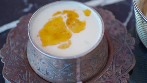 turkish yogurt soup in a copper bowl