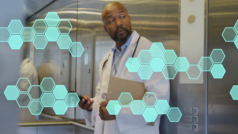 animation of cell structures processing data over african american male doctor using smartphone