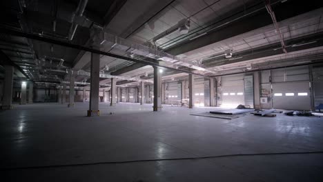 big and modern warehouse under construction, featuring metal shelving and other industrial equipment.