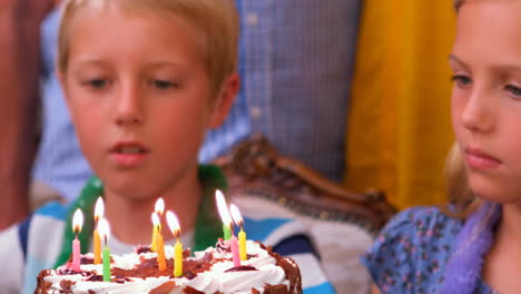 cute siblings celebrating their birthday with their family