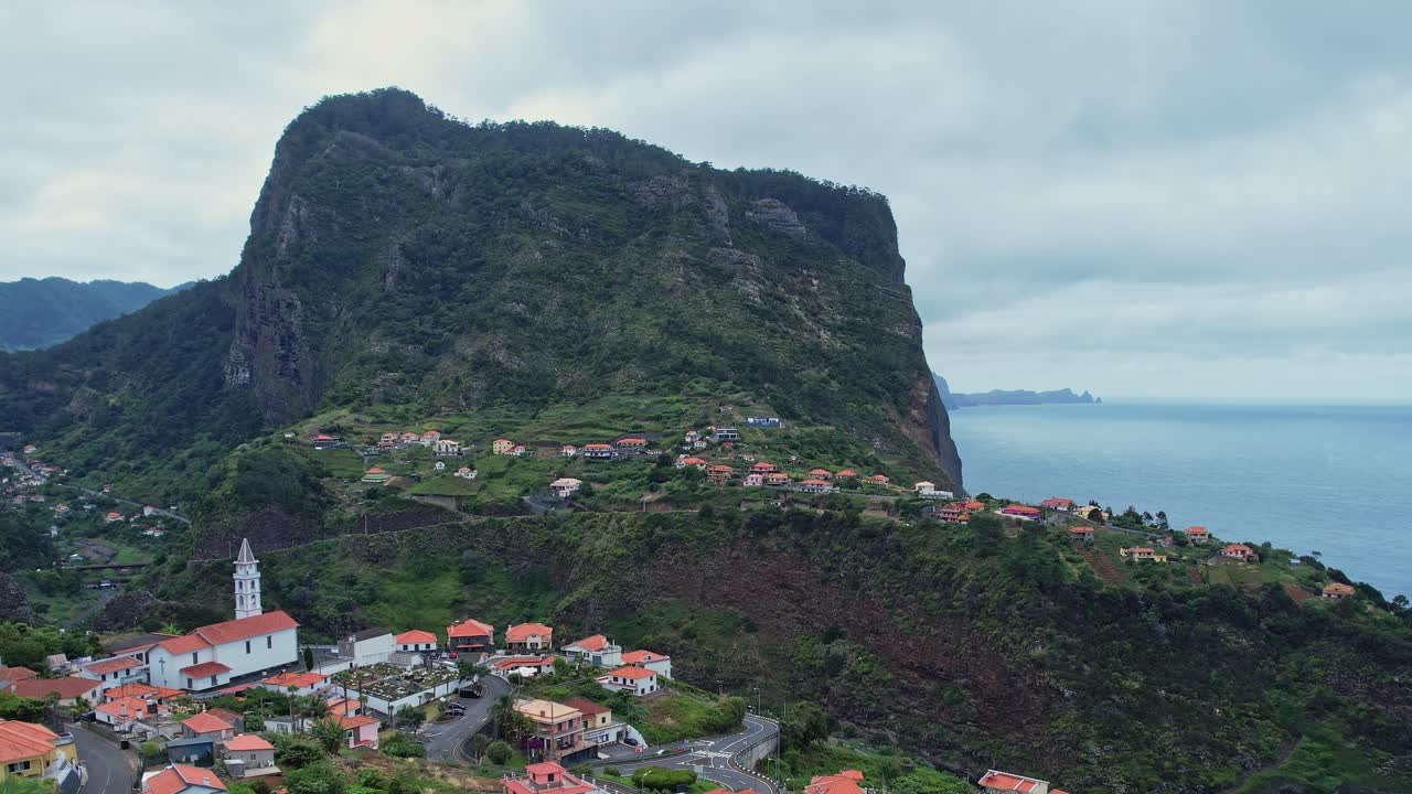 Drone view of scenic Madeira coastline with charming village below