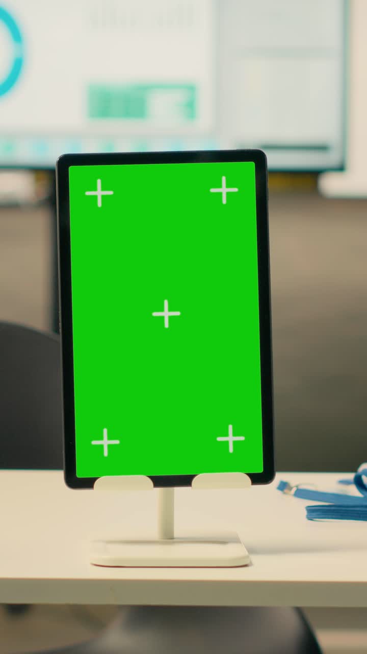 Vertical Video Tablet, vertical green screen, empty business office, organized work environment