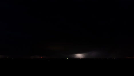 lightning bolts flash through a storm cloud time lapse